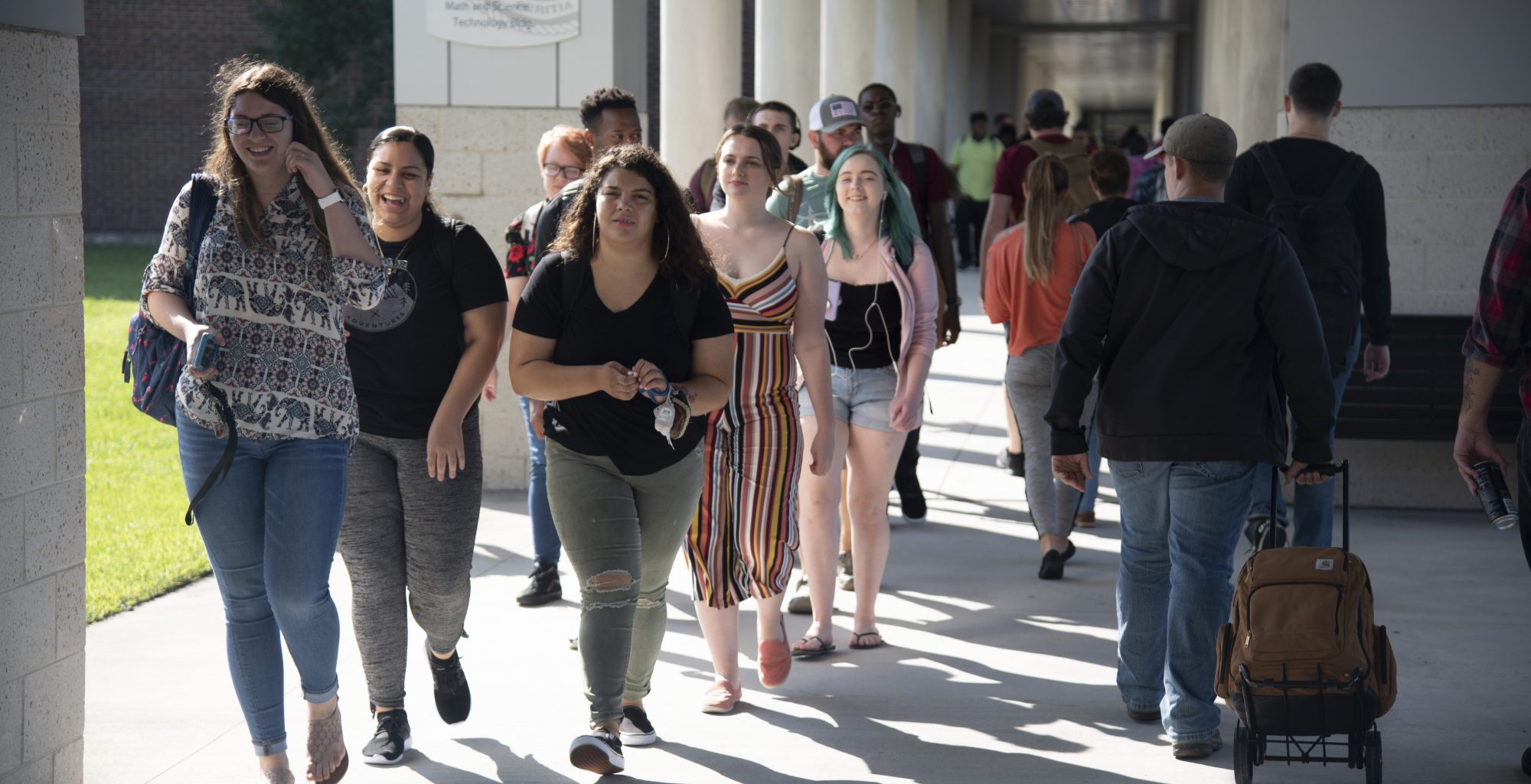 Coastal students walking between classes