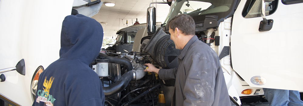 Coastal Students Working on a diesel engine