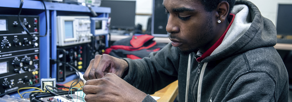 Coastal Student working on electronics engineering