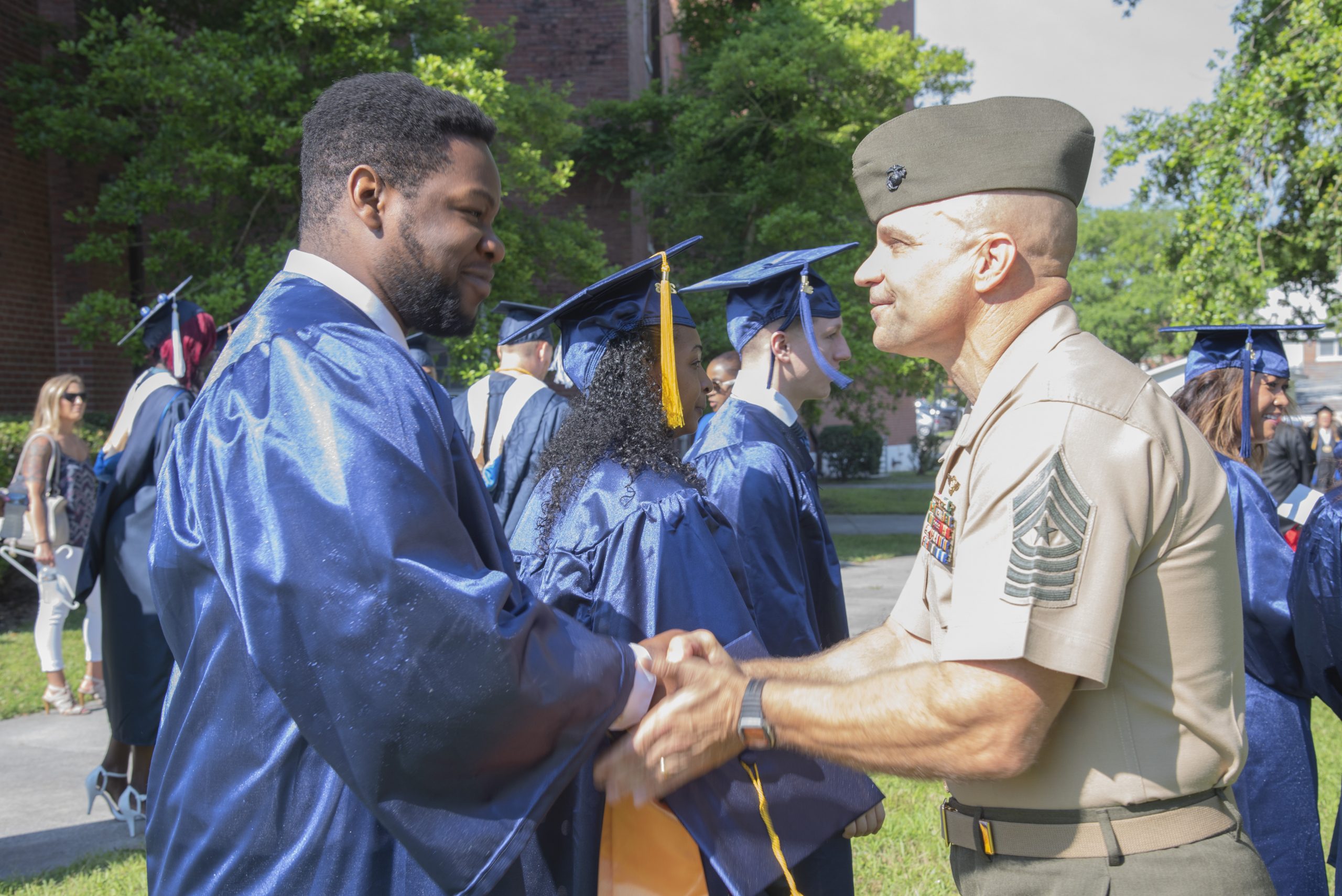 a photo of a graduate being congratulated